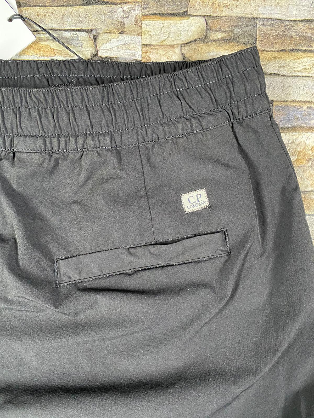 C.P. COMPANY NYLON FULL STRECTH LENS TRACK PANTS - X Clothing C.P. COMPANY NYLON FULL STRECTH LENS TRACK PANTS - X Clothing